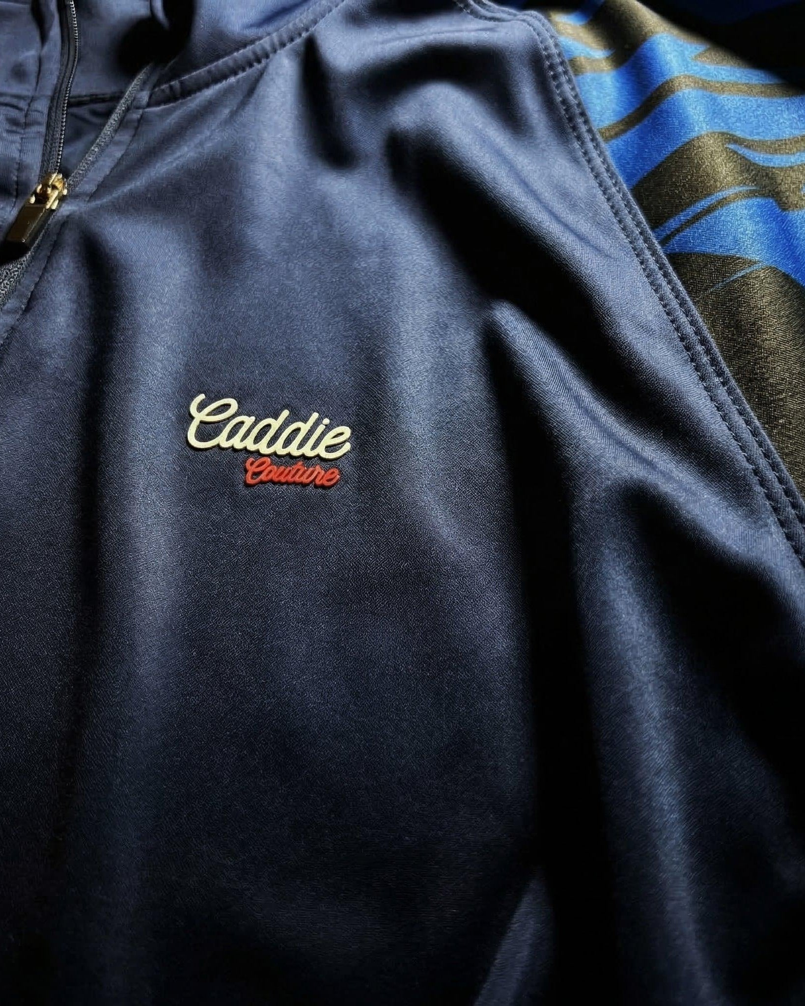 close up of midnight geo quarter zip