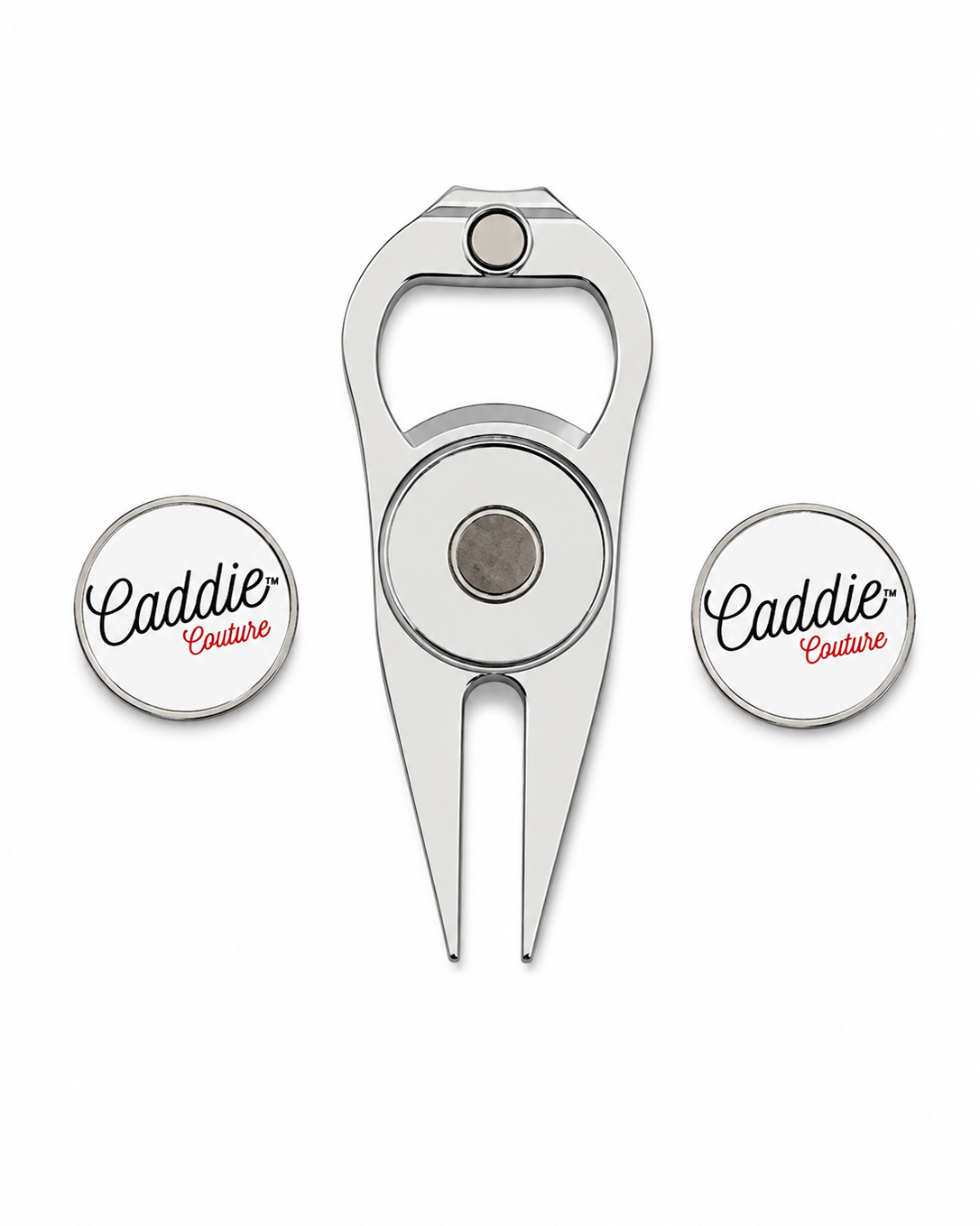 A silver metal golf divot tool set with two matching circular magnetic golf ball markers featuring the 'Caddie Couture' logo, displayed on a clean white background.