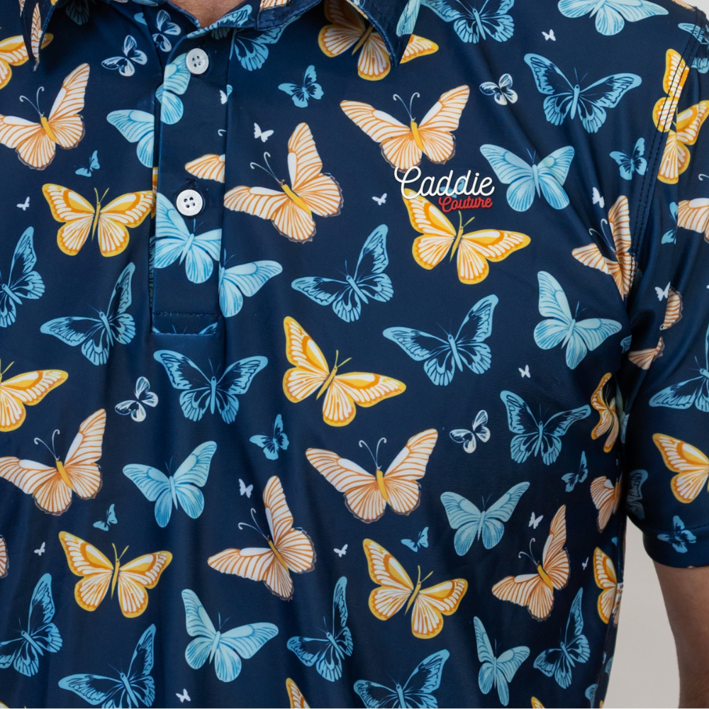 Navy blue polo shirt with yellow and blue butterfly pattern