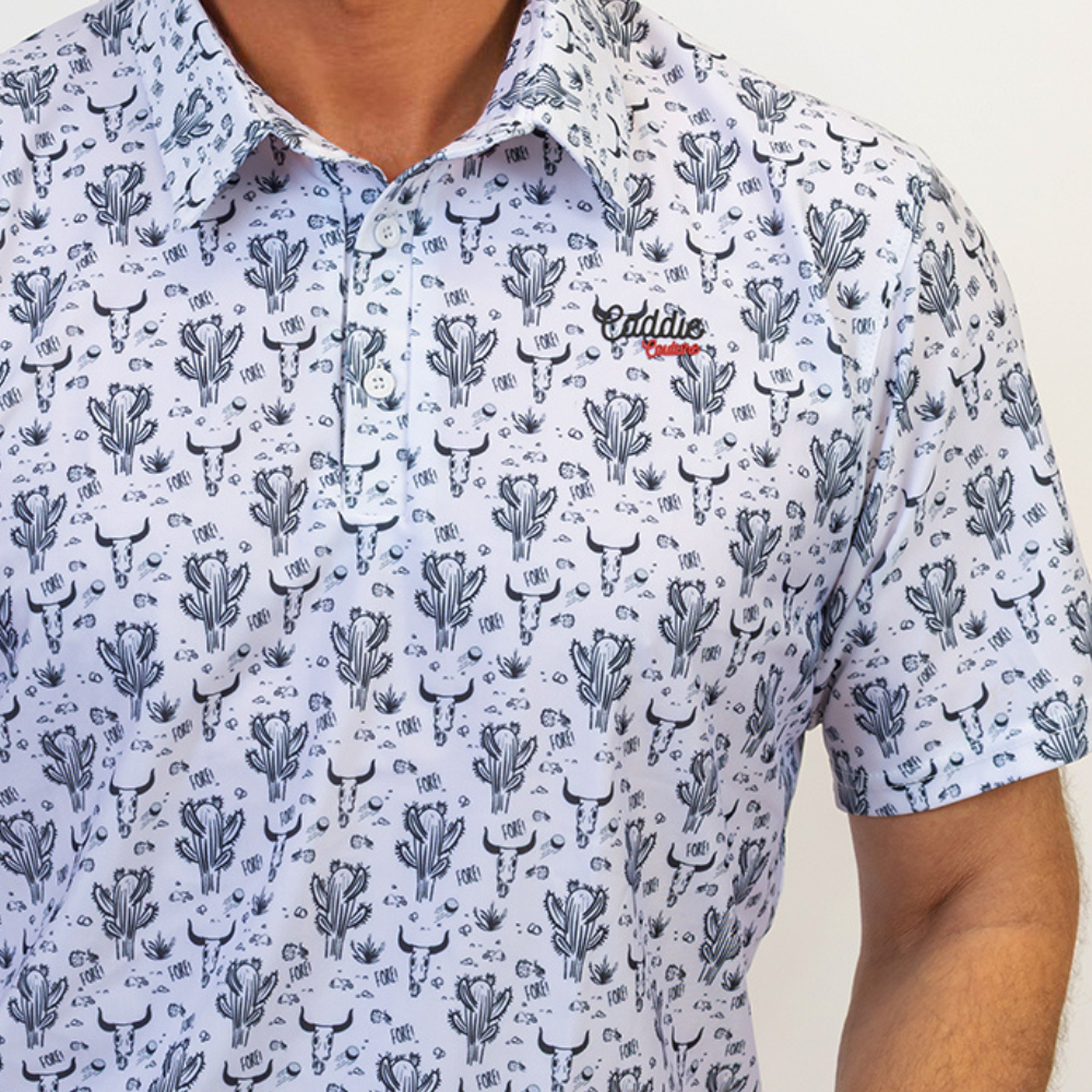 Short-sleeve shirt with cactus pattern and Caddie Couture logo on a beige background