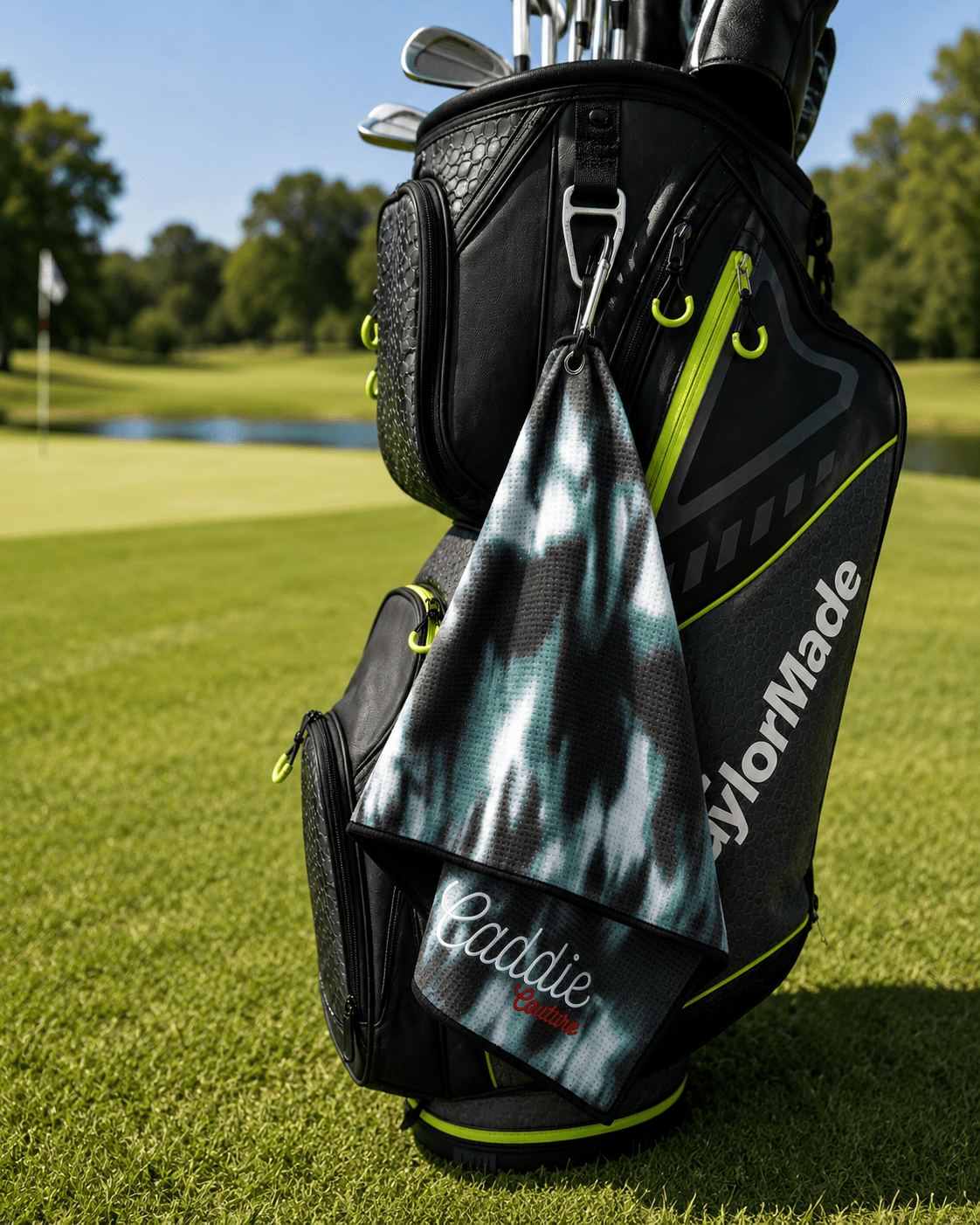 Golf bag with a towel and golf clubs on a golf course