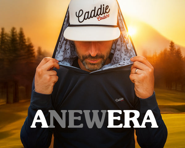 Man wearing a cap and hoodie with 'Caddie Couture' branding, standing on a golf course at sunset.