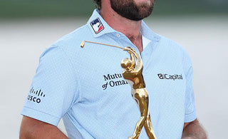 Cameron Young Holding Trophy