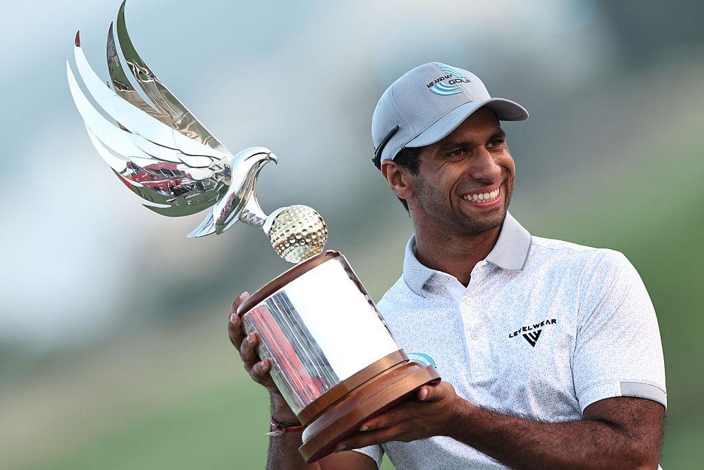 Aaron Rai holding Trophy