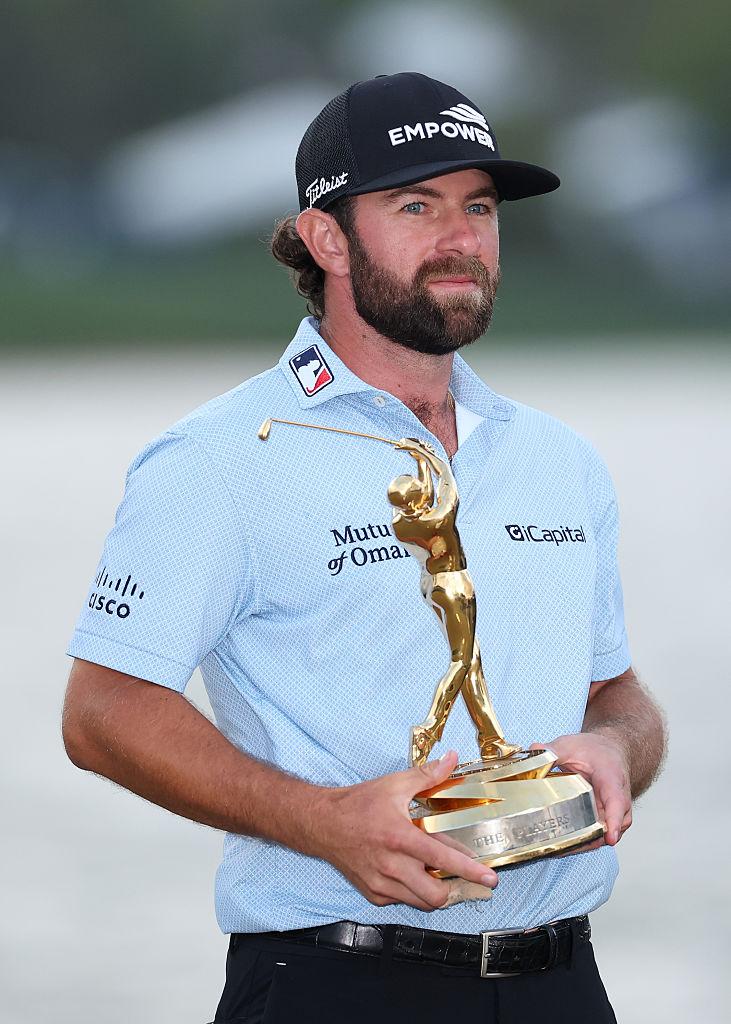 Cameron Young Holding Trophy