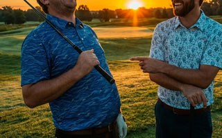 two men laughing on a golf course