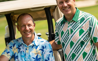 2 mean near a golf buggy looking at the camera