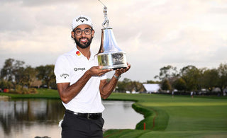 Akshay Bhatia holding trophy
