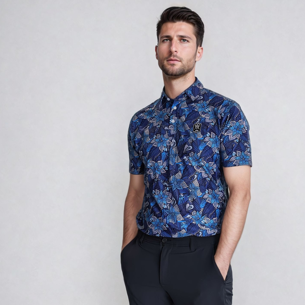Model wearing Blue Floral Golf Polo with hands in pocket