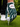 A close-up of a golf glove worn on a hand, holding a golf ball on a tee. The glove has a dark teal and green camouflage pattern with white trim and a white brand patch that reads 'Caddie Collection'.
