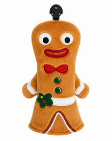 A plush gingerbread golf club headcover or decorative figure on a plain white background. The figure is brown with white trim, a red bow tie, green buttons, and a green and red flower detail on the front, with a small black top piece at the head.