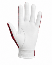 A white leather golf glove with red patterned accents on the sides of the fingers and back, shown against a plain white background.