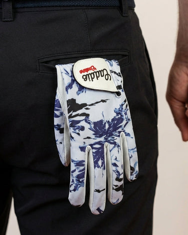 Golf glove with blue floral pattern and 'Caddie Couture' branding