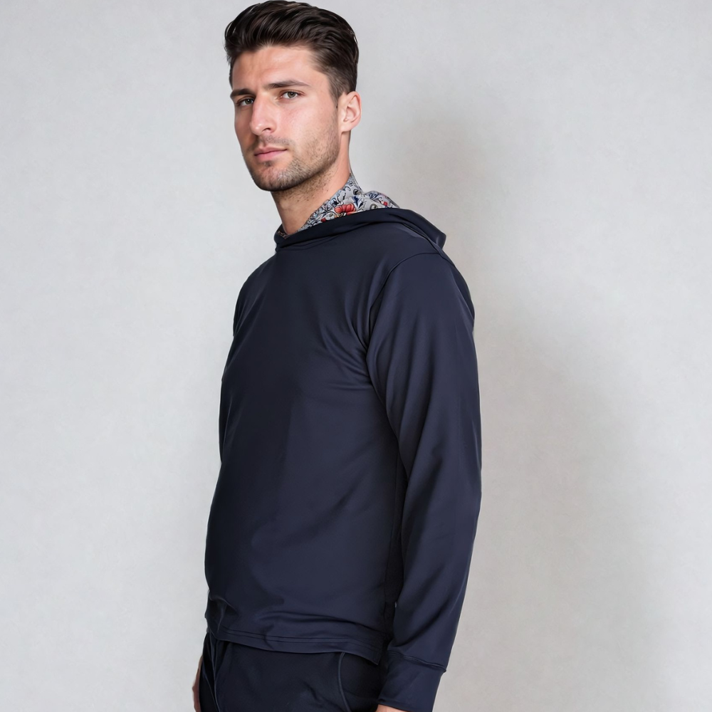 A male model wearing a Floral Performance Golf Hoodie