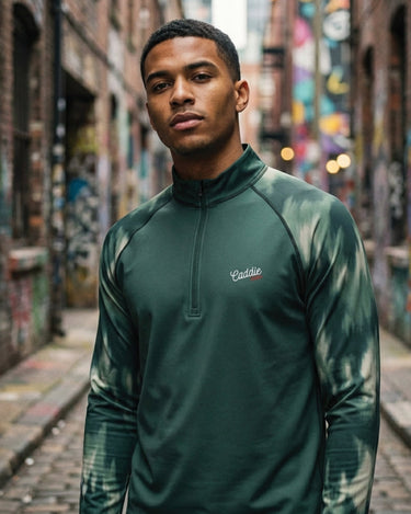 Man wearing a green jacket with a brand logo in an urban alleyway.