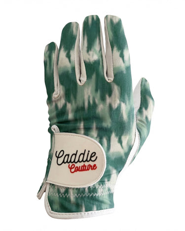 Golf glove with tie-dye pattern and 'Caddie Couture' branding on a white background