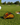 Taco-shaped golf marker on a golf course with a golf ball and hole in the background.