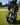 Golf bag with a towel and golf clubs on a golf course
