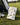 Golf bag with bird-themed pouch on a golf course