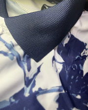 Close-up of a blue strap on a floral-patterned fabric background