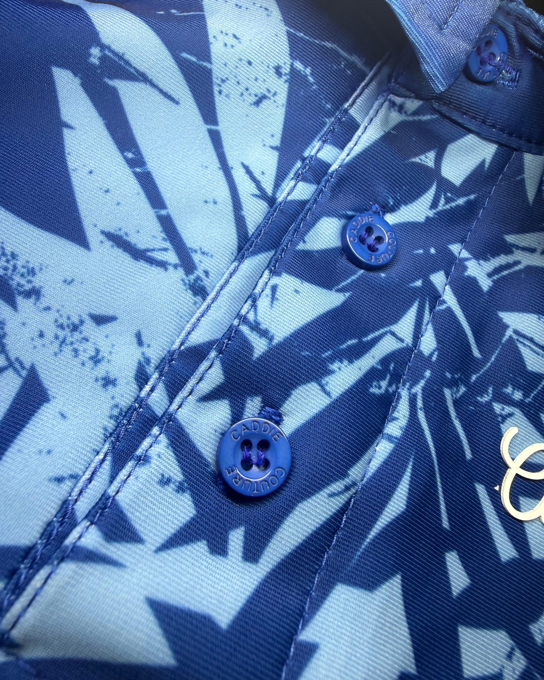 Close-up of a blue and white patterned shirt with buttons