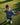 Young boy holding a golf club on a golf course