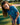 Young girl in a blue patterned outfit standing on a golf course