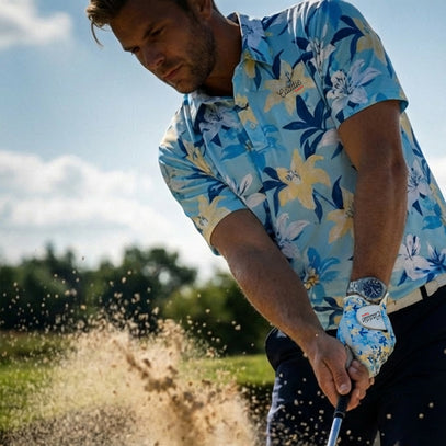 man hitting a bunker shot wearing lily golf polo