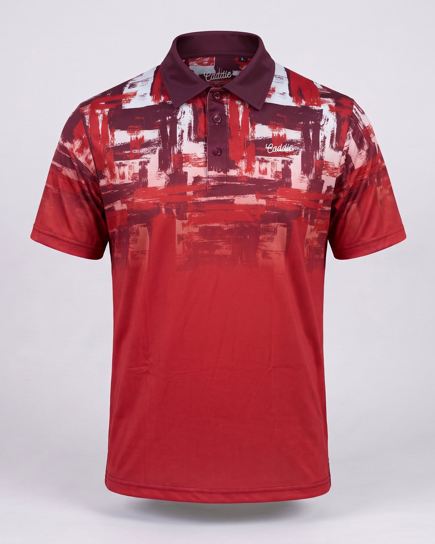 A short-sleeve polo shirt with a red, burgundy, and white abstract brushstroke pattern, displayed on a light gray background.