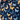 Navy blue shirt with colorful butterfly pattern and 'Caddie Couture' branding.