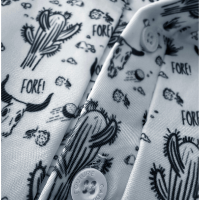 Close-up of a shirt with black cactus and skull designs on white fabric.