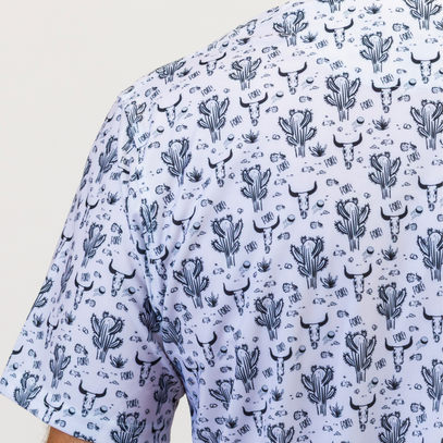White shirt with black cactus and bull pattern on a white background