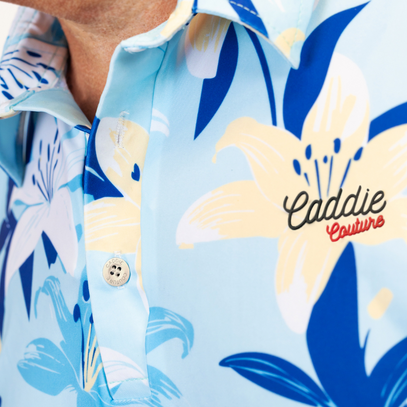 Floral patterned shirt with 'Caddie Couture' branding on a light blue background
