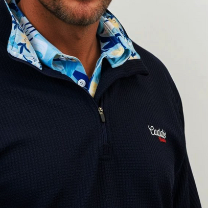 Navy pullover with a colorful collar and 'Caddie' logo on a light gray background