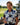 Woman holding a golf club on a golf course with a clubhouse in the background