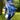 Blue floral golf glove on a golf ball with a blurred green background
