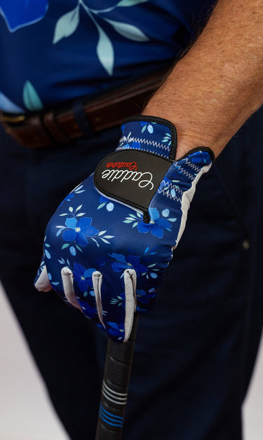 Blue floral-patterned golf glove with a brand logo on a white background