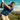 man swinging golf club wearing floral golf polo 