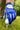 Blue golf glove on a golf ball with a blurred green background