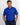 Man wearing a blue patterned golf polo shirt with a visible caddie couture logo on a white background