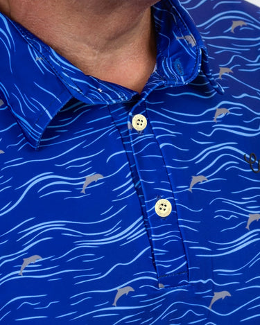 Close-up of a blue patterned golf shirt with white buttons
