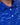 Close-up of a blue patterned golf shirt with white buttons
