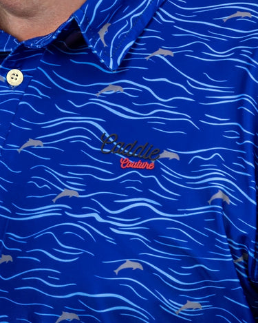 Blue polo shirt with wave pattern and 'Caddie Couture' logo