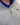 Man wearing golf quarter zip with blue wave pattern in neck
