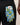 Blue floral-patterned golf glove with a white brand label on a black background