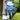 Golf glove with butterfly pattern holding a golf ball on grass
