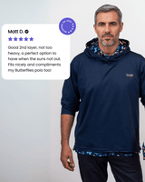 Man wearing a navy golf hoodie with a brand logo, standing against a plain background.