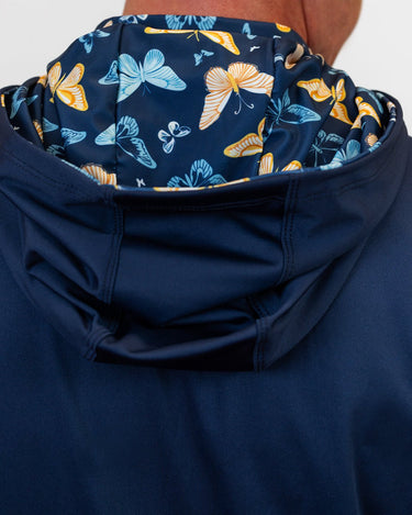 Navy blue golf hoodie with a butterfly pattern on the hood