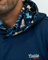 Navy blue hoodie with floral pattern on hood and 'Caddie Couture' branding.