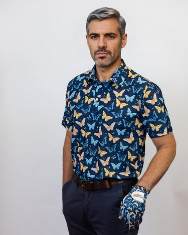 Male Model Wearing Butterfly Patter Golf Polo with a matching Butterfly Golf Glove. Model is posing with a Golf club in hand 